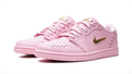 Air Jordan 1 Low Sneakers – Pastel Pink with Gold-Tone Swoosh